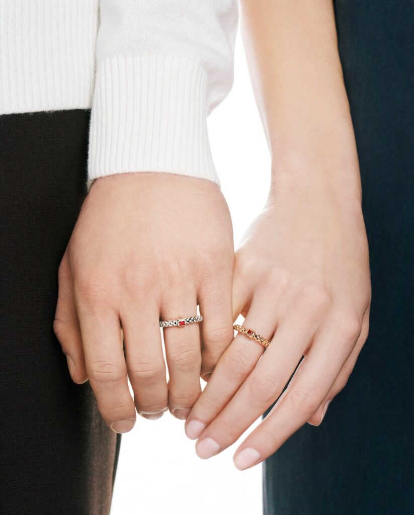 couple holding hands while wearing FOPE Souls Rings
