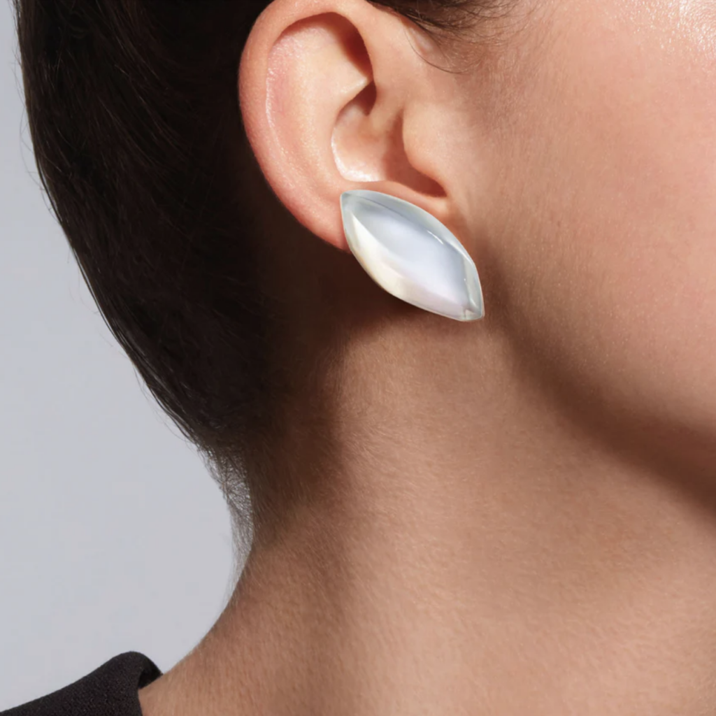 woman wearing aladino mother of pearl crystal earrings from vhernier