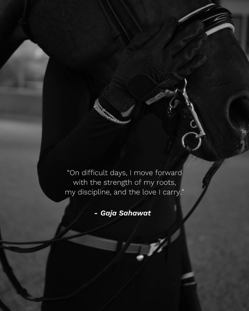 gaja showcasing italian jewelry from scintilla as she holds her horse