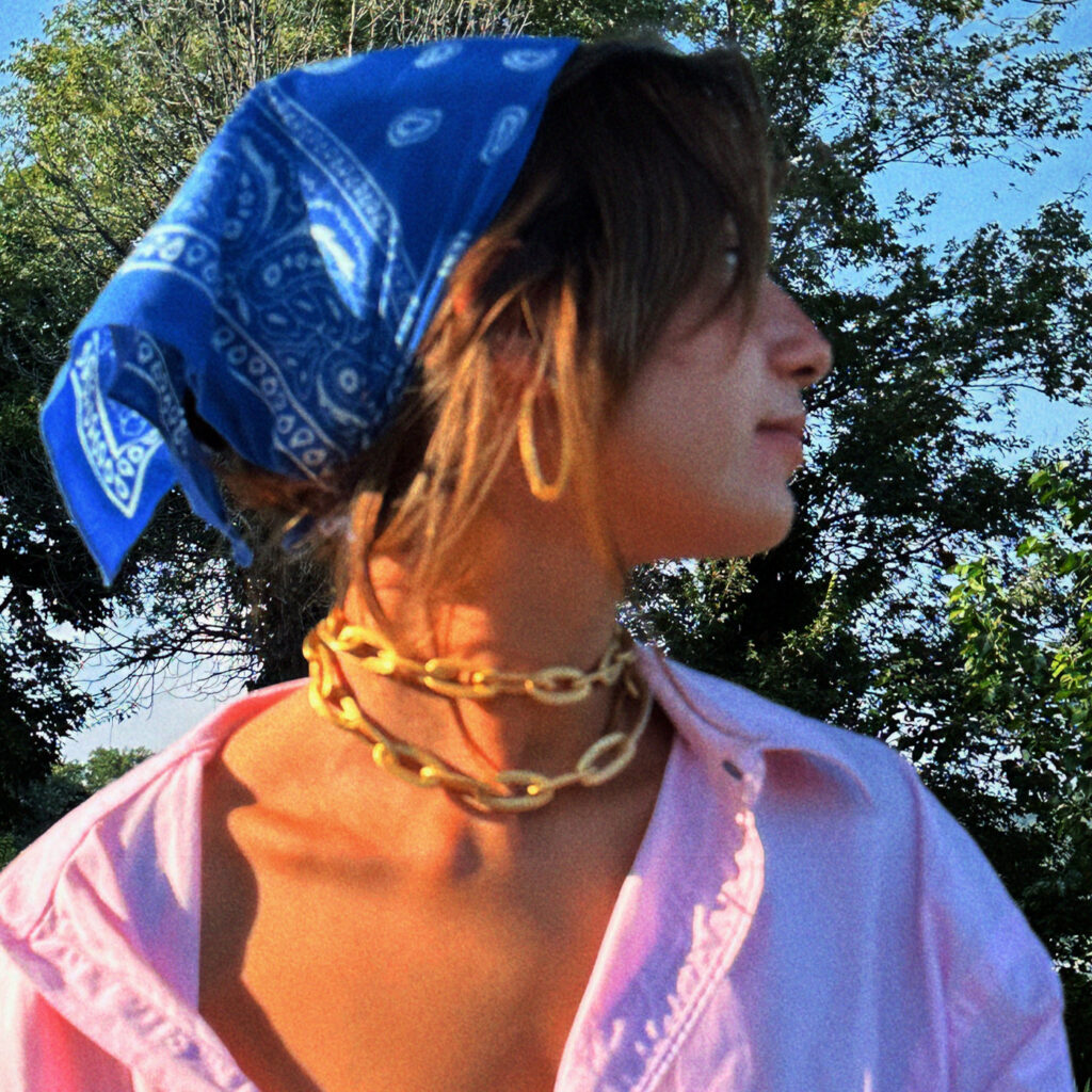 woman wearing nanis jewelry on a summer day