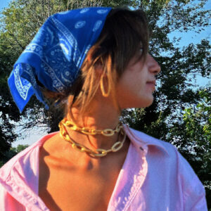 woman wearing nanis jewelry on a summer day